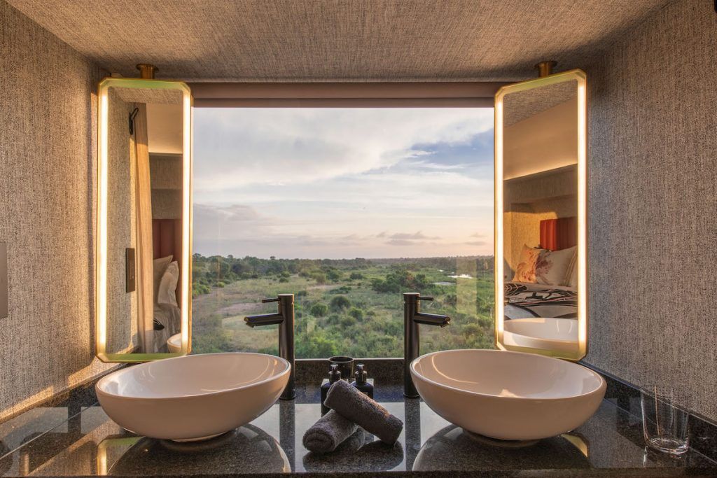 Kruger Shalati carriage bathroom with two sinks and window overlooking Kruger National Park