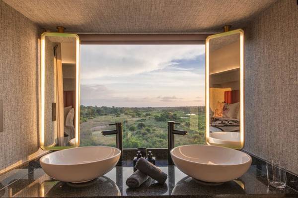 Twin sinks with window overlooking Kruger National Park