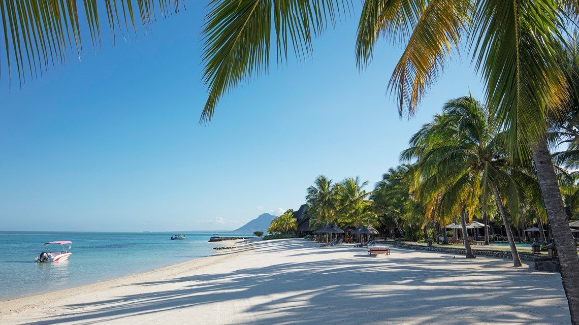 Exquisite white sand, turquoise sea and azure sky at Paradis Beach, Beachcomber resort, Mauritius