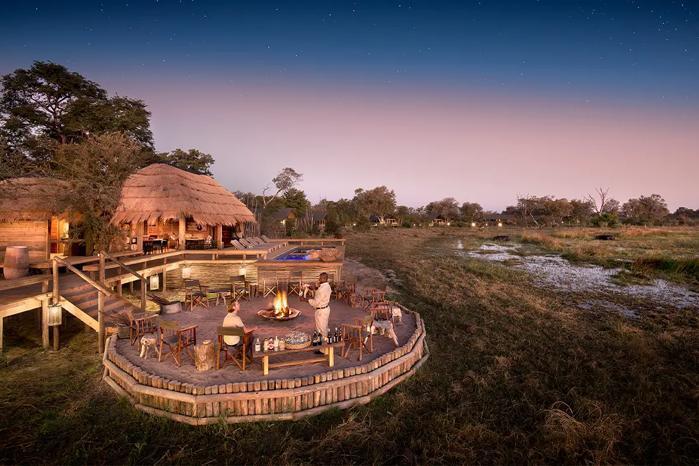 Sable Alley elevated lodge and fireplace area surrounded by lush landscape