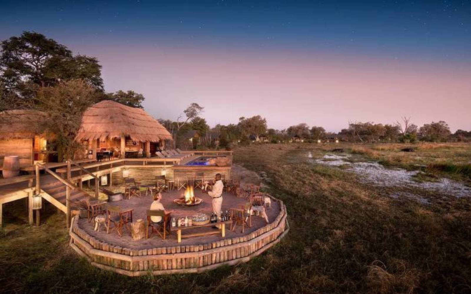 Sable Alley elevated lodge and fireplace area surrounded by lush landscape