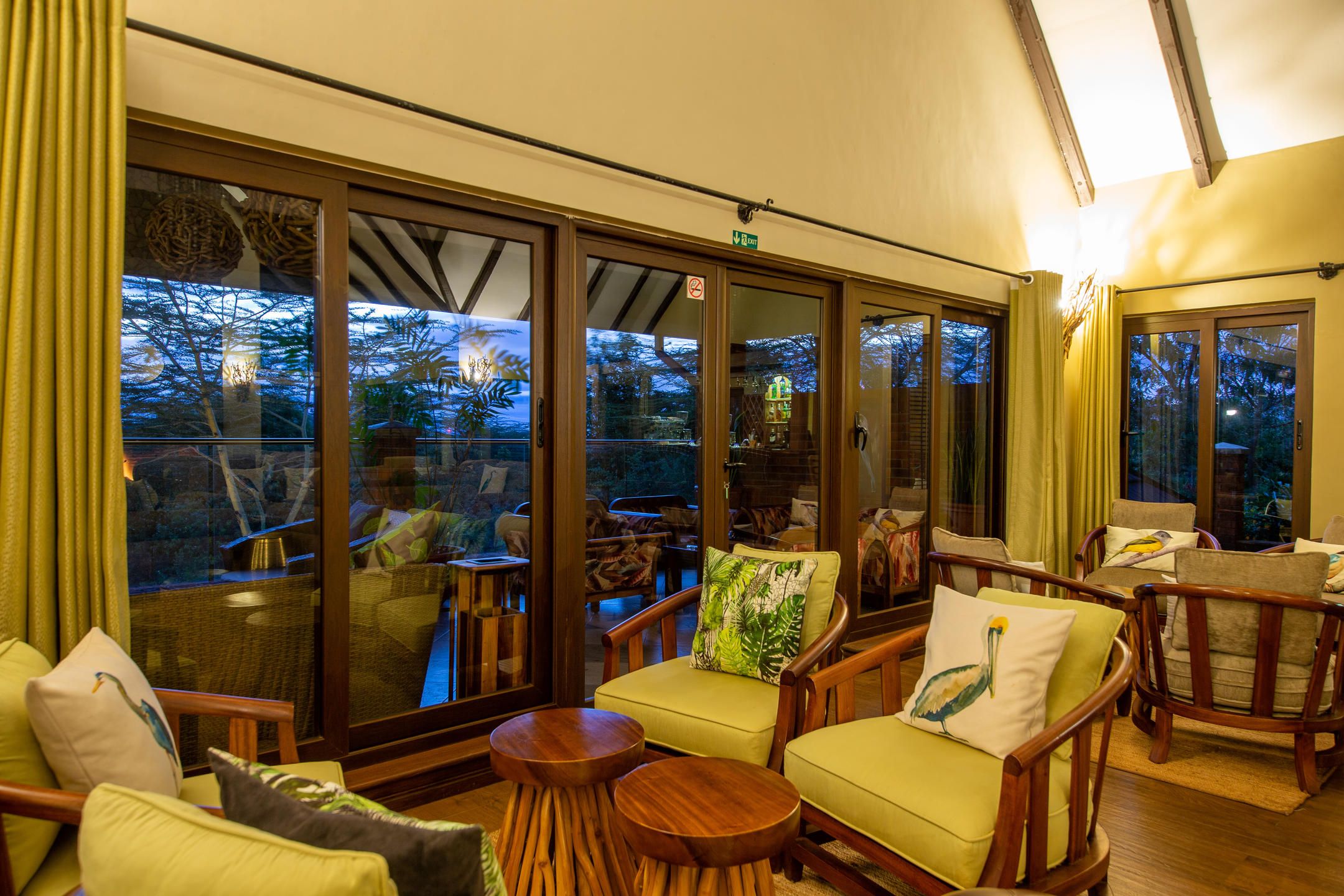 Lounge with armchairs and big sliding door windows