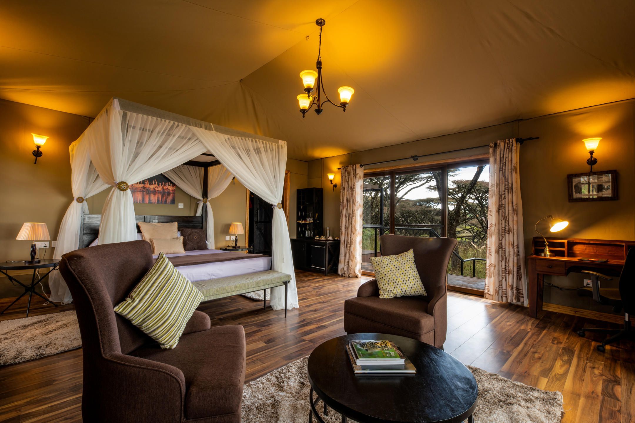 Luxury suite with four poster double bed and mosquito net