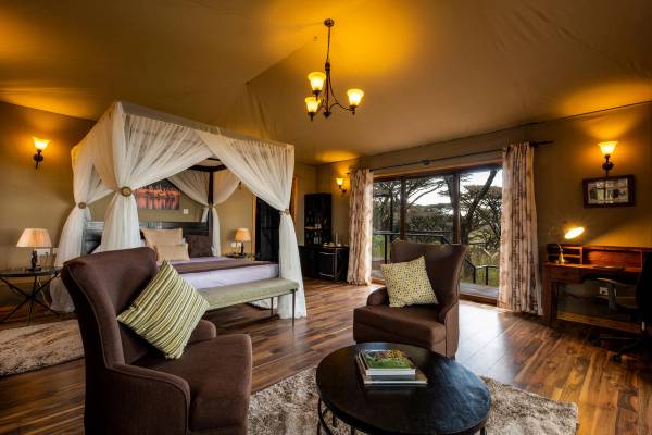 Luxury suite with four poster double bed and mosquito net