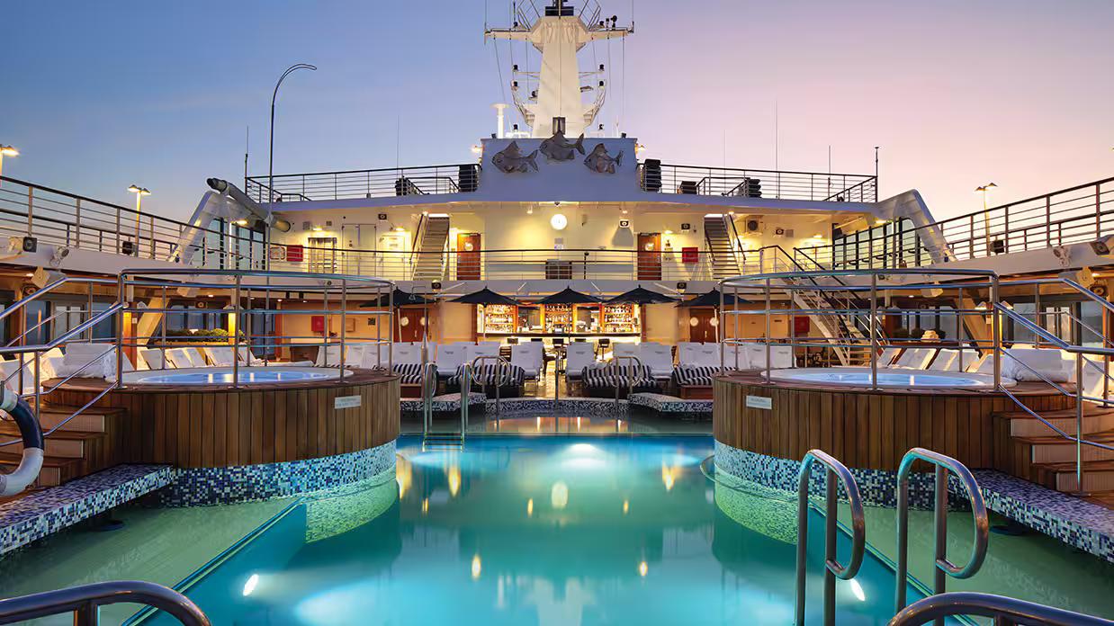 Sirena Pool Deck – Spacious deck with pool, cabanas, and loungers