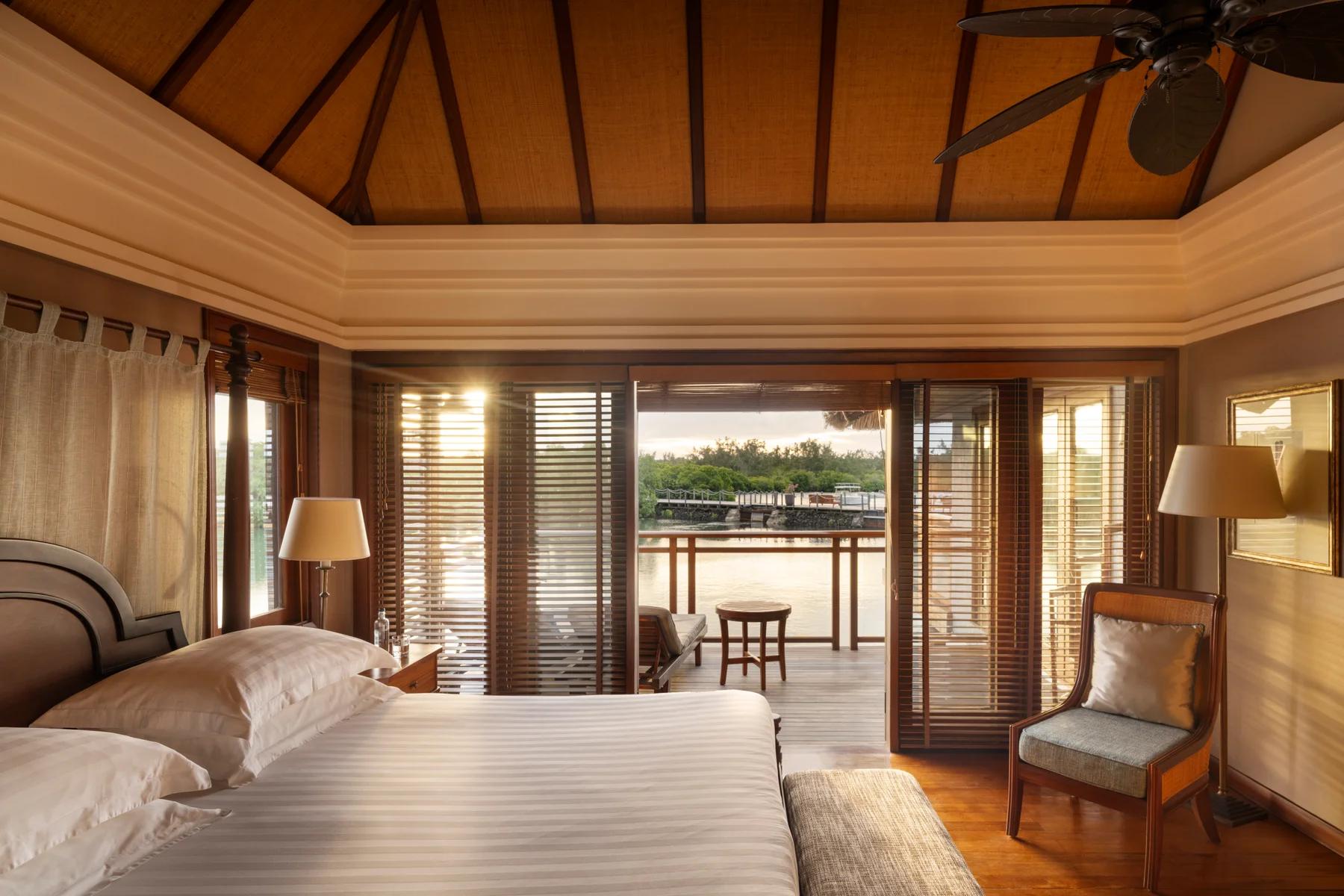 Bedroom suite with patio overlooking water