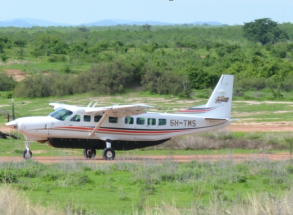 Small air craft on landing strip in Central Serengeti
