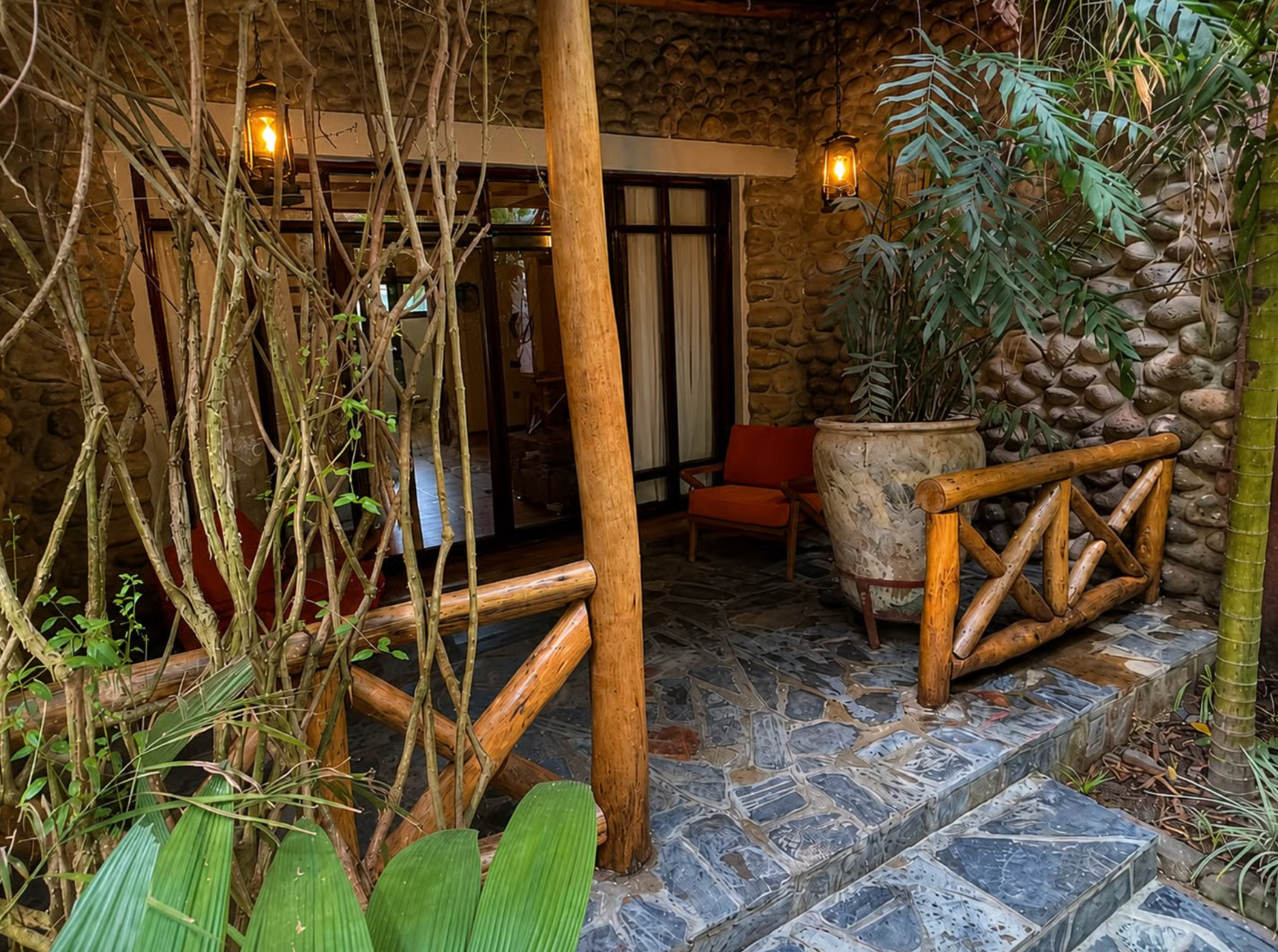Front veranda with slate floor and red armchair