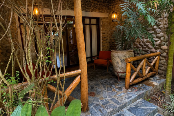 Front veranda with slate floor and red armchair