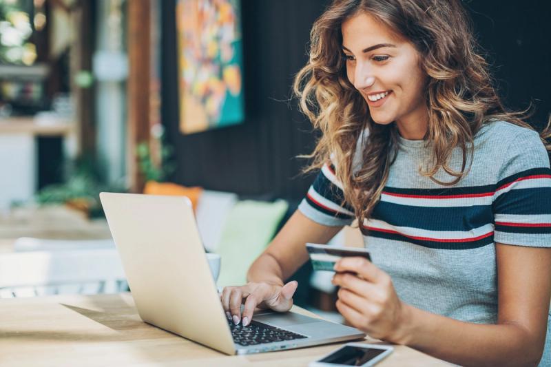 Excited woman working with data reports