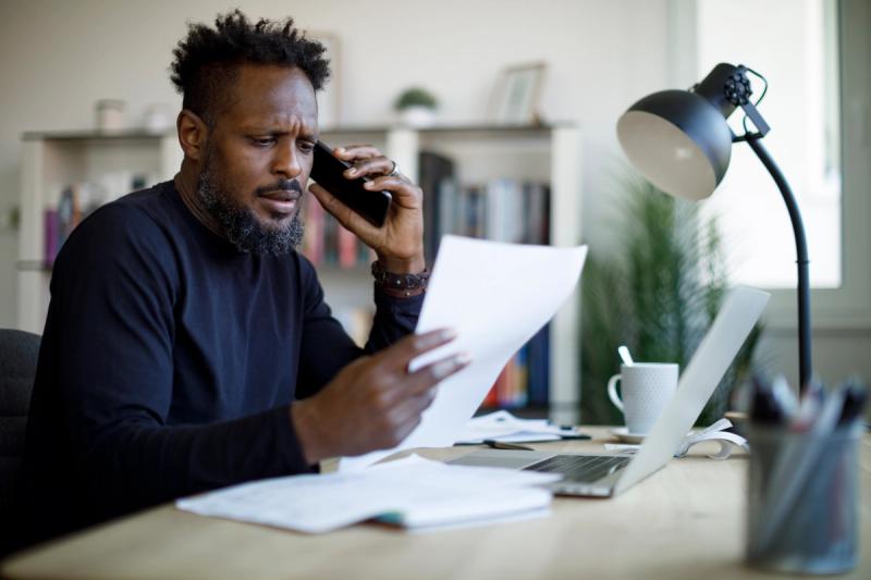 Man frustrated on the phone