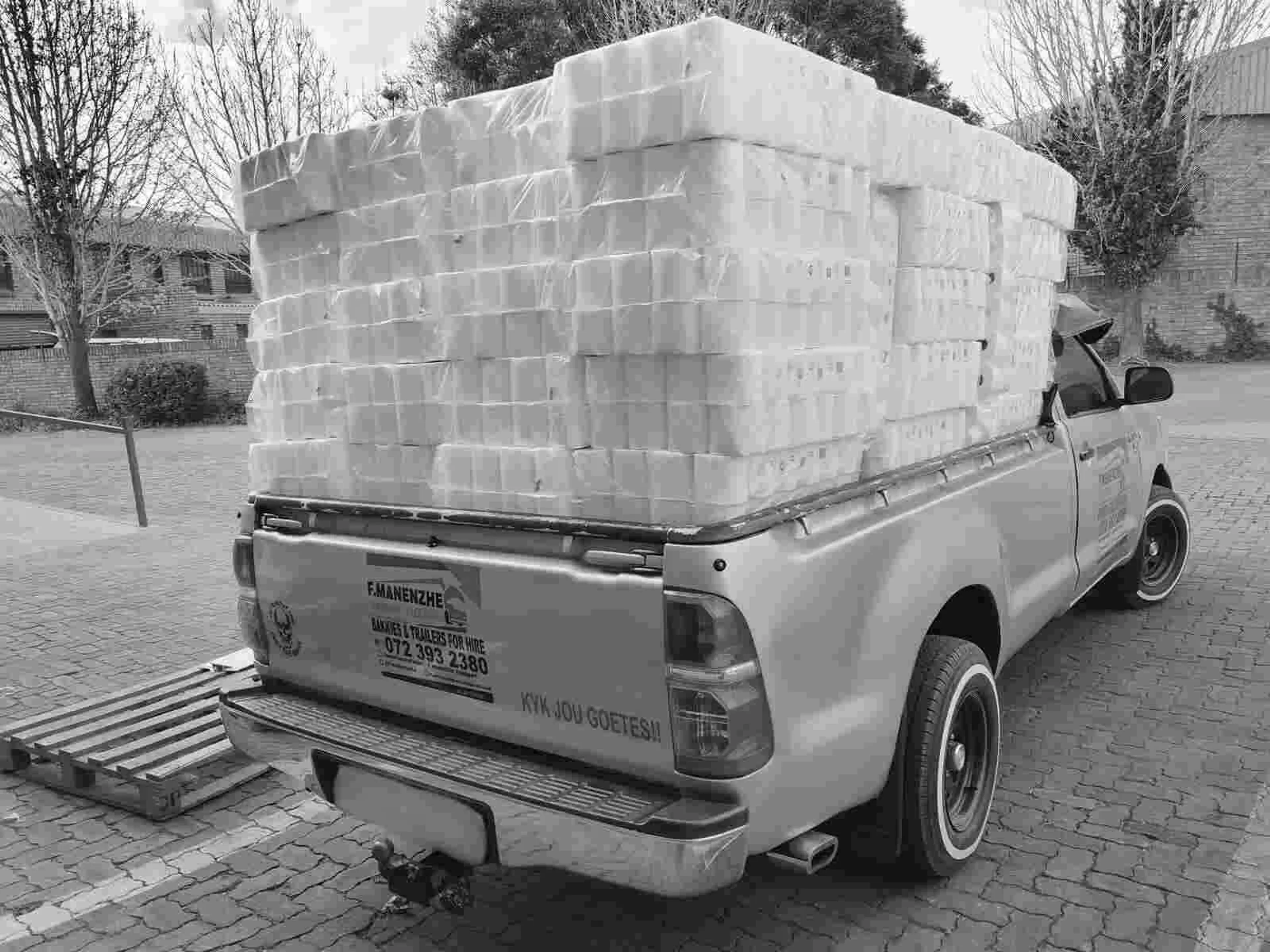 Bakkie being loaded with bulk toilet paper