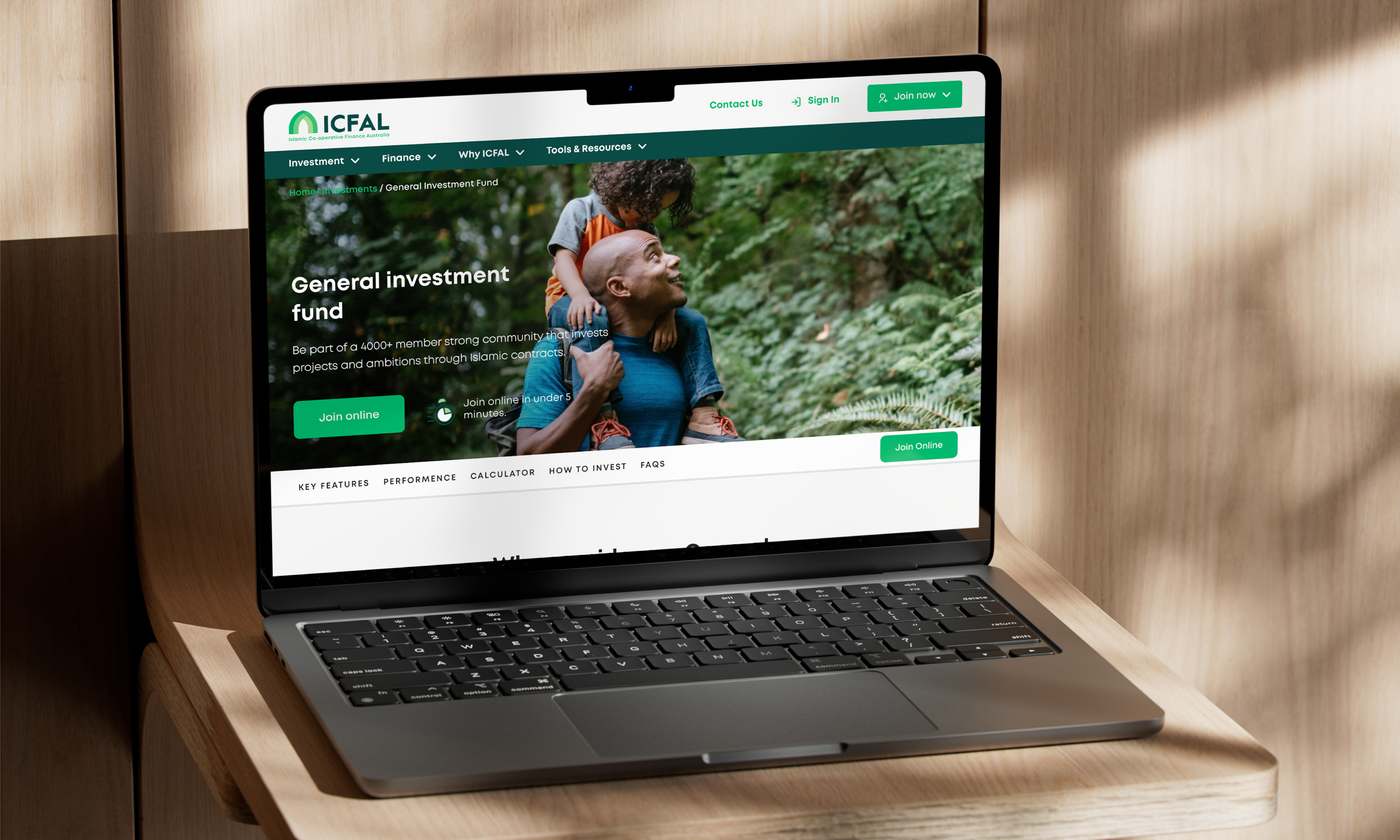 ICFAL General Investment Fund page on a laptop, featuring a father carrying his child through a forest