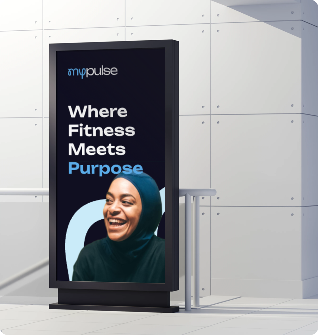 MyPulse digital signage reading 'Where Fitness Meets Purpose' with a smiling woman in a hijab