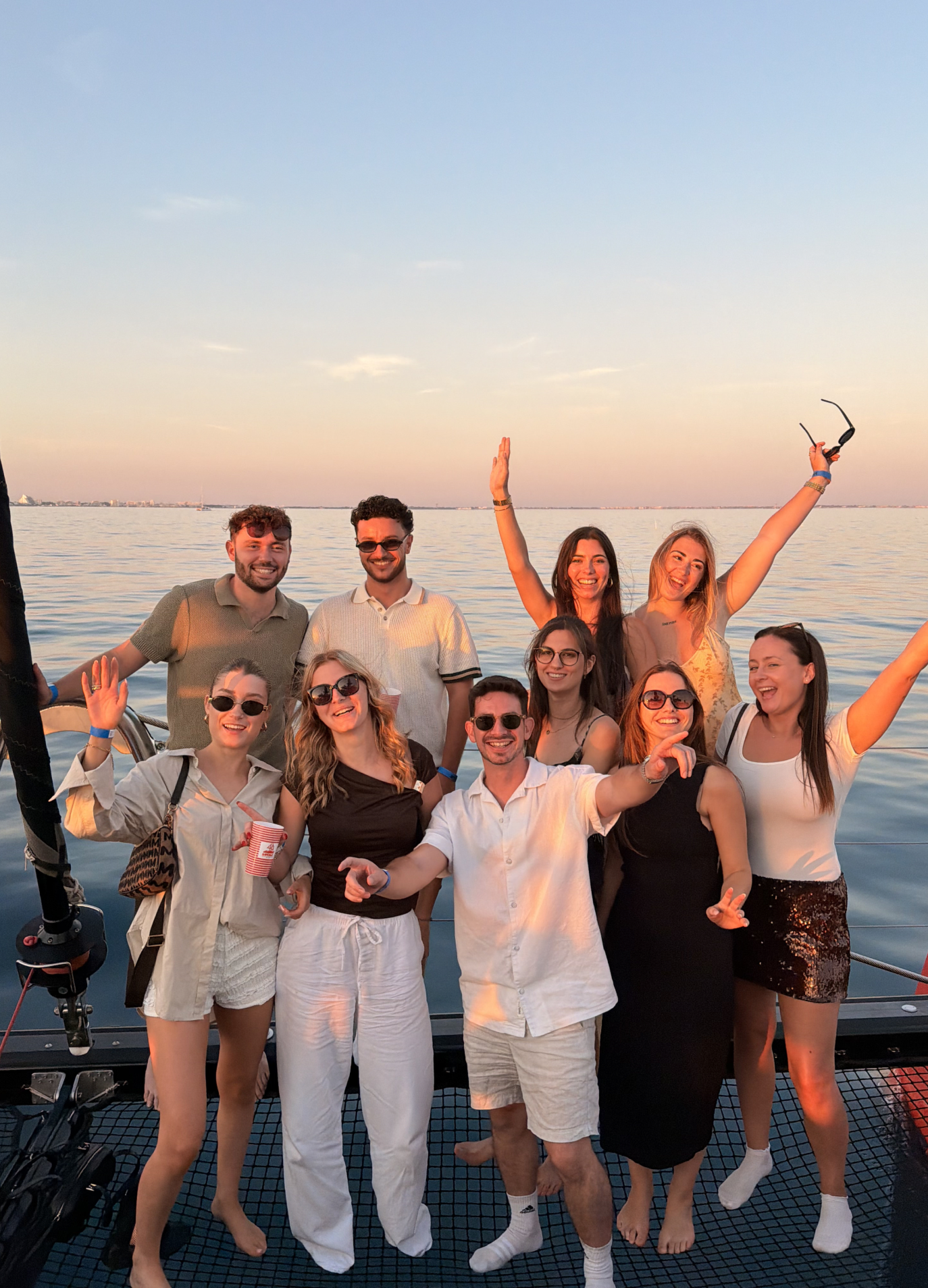 The Lumera team on a boat at sunset