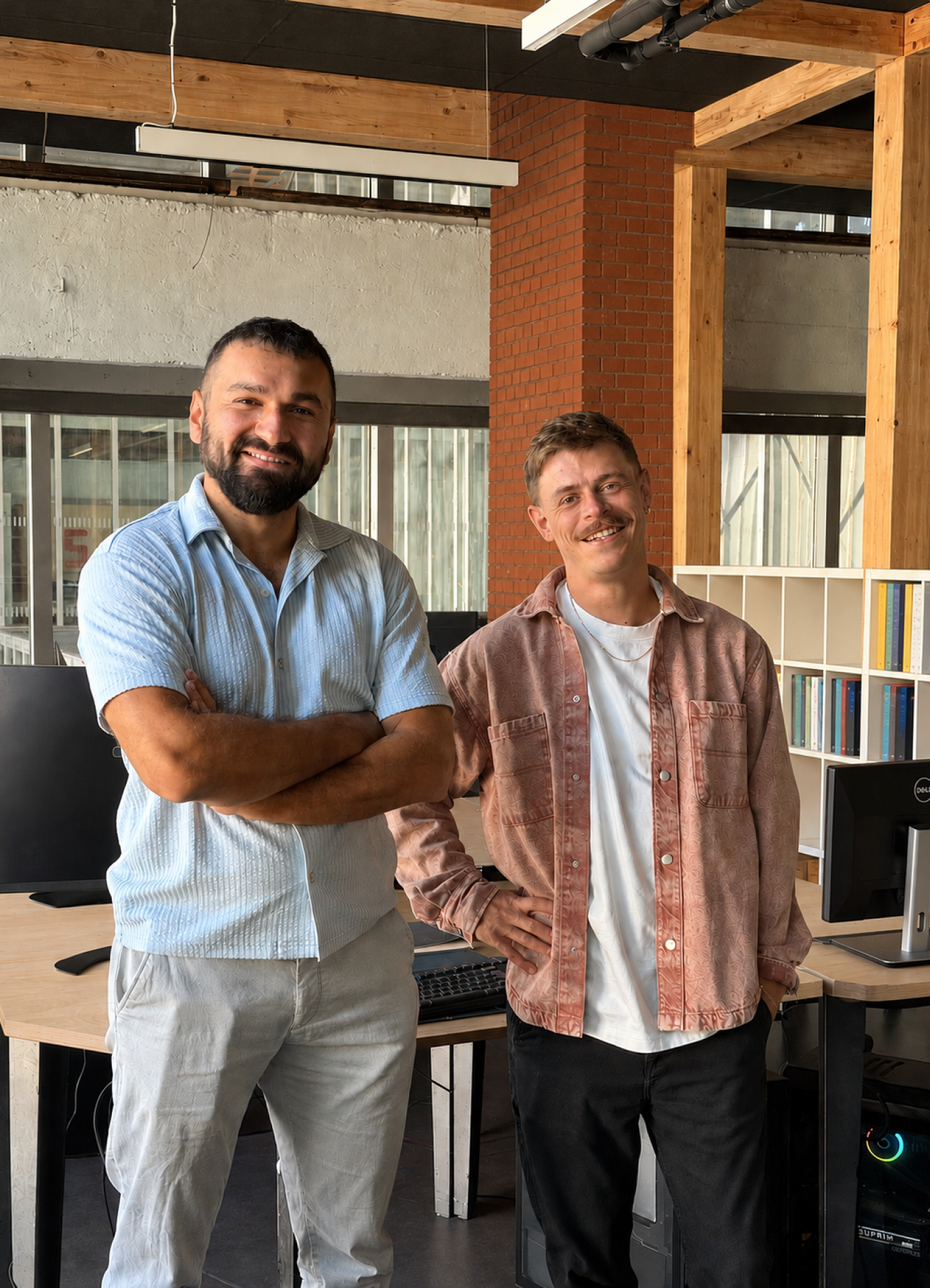 Two members of the La Combine team standing in their studio