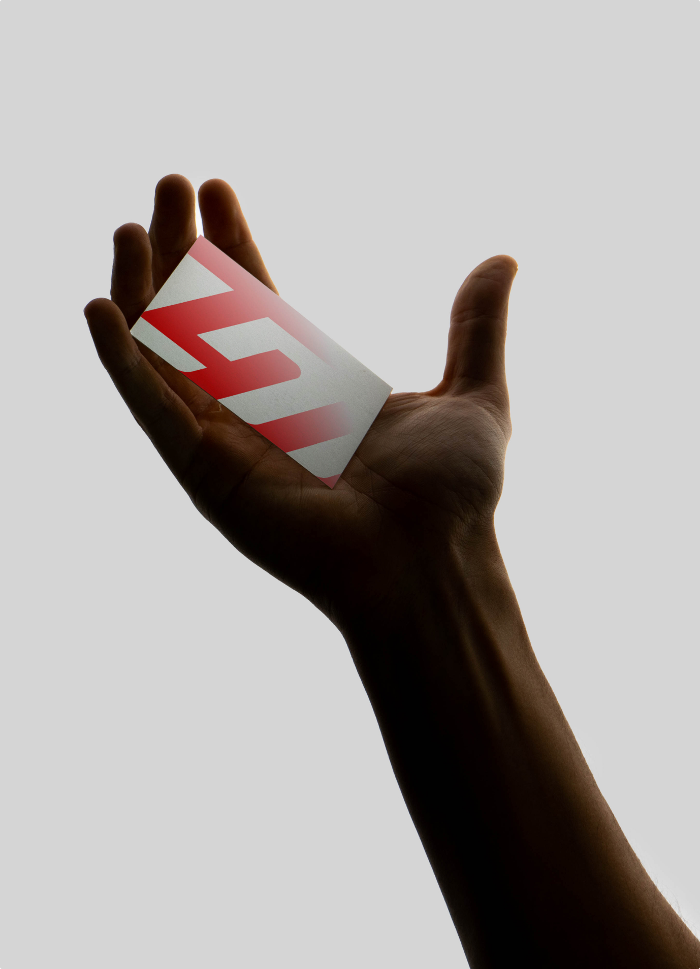 Hand holding a red LM Factory card