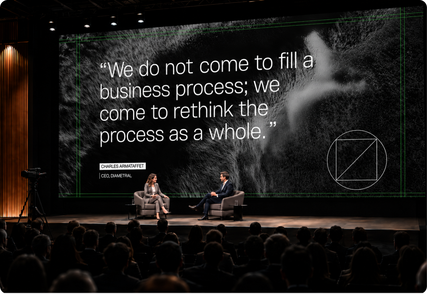 A Diametral talk on stage, in front of the quote “We do not come to fill a business process; we come to rethink the process as a whole.”
