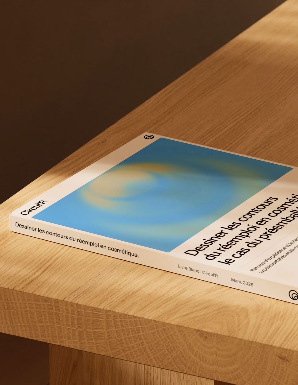 A Circul’R printed report lying on the corner of a wooden table