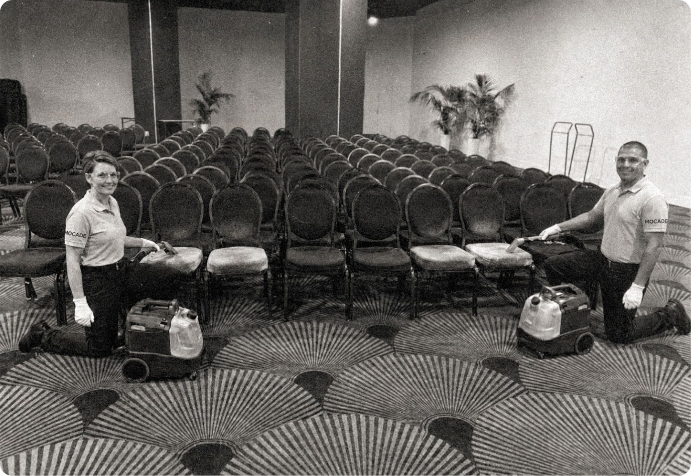 Mocade technicians cleaning the chairs of a conference room