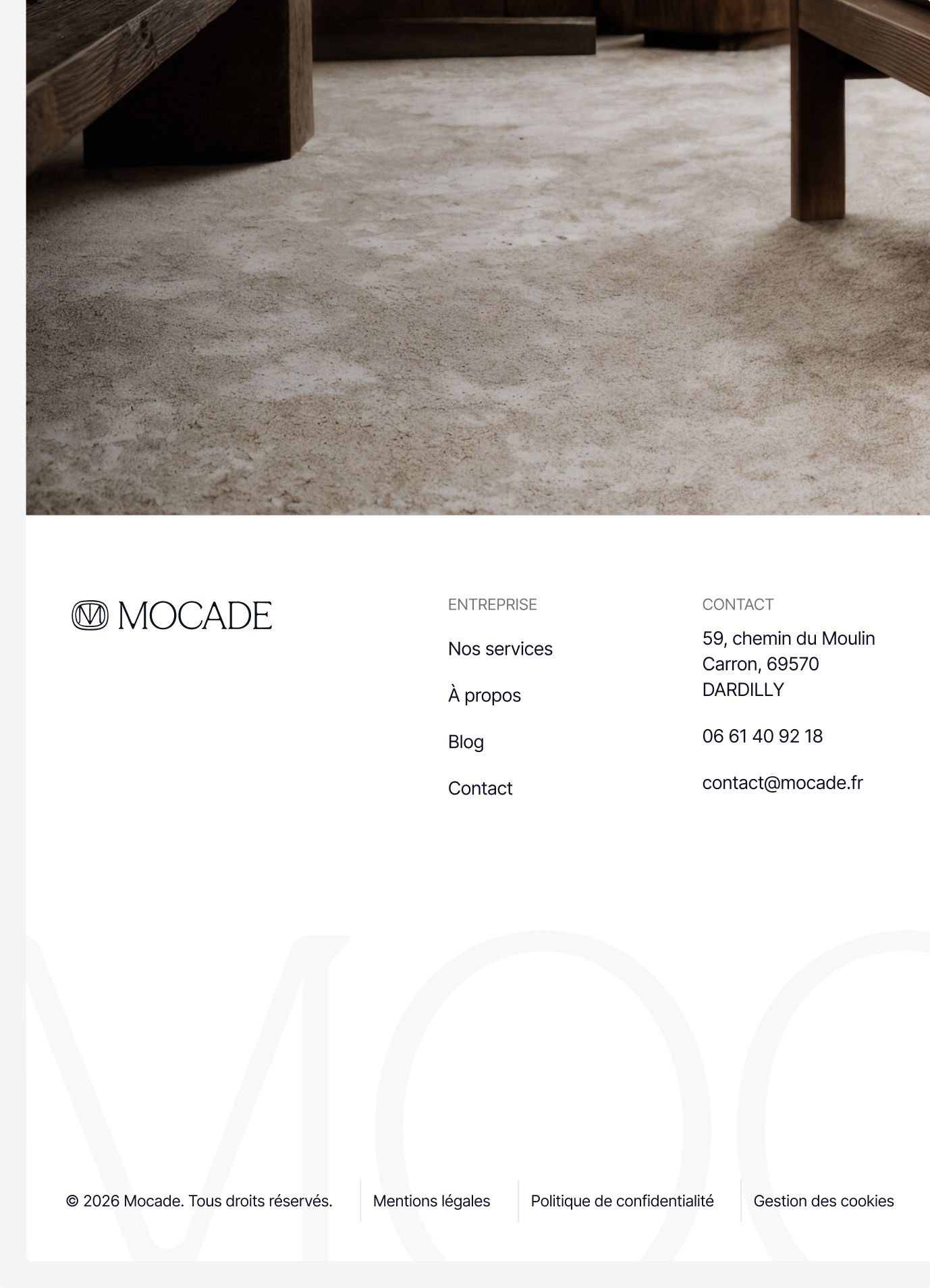 Mocade website footer under a carpet close-up