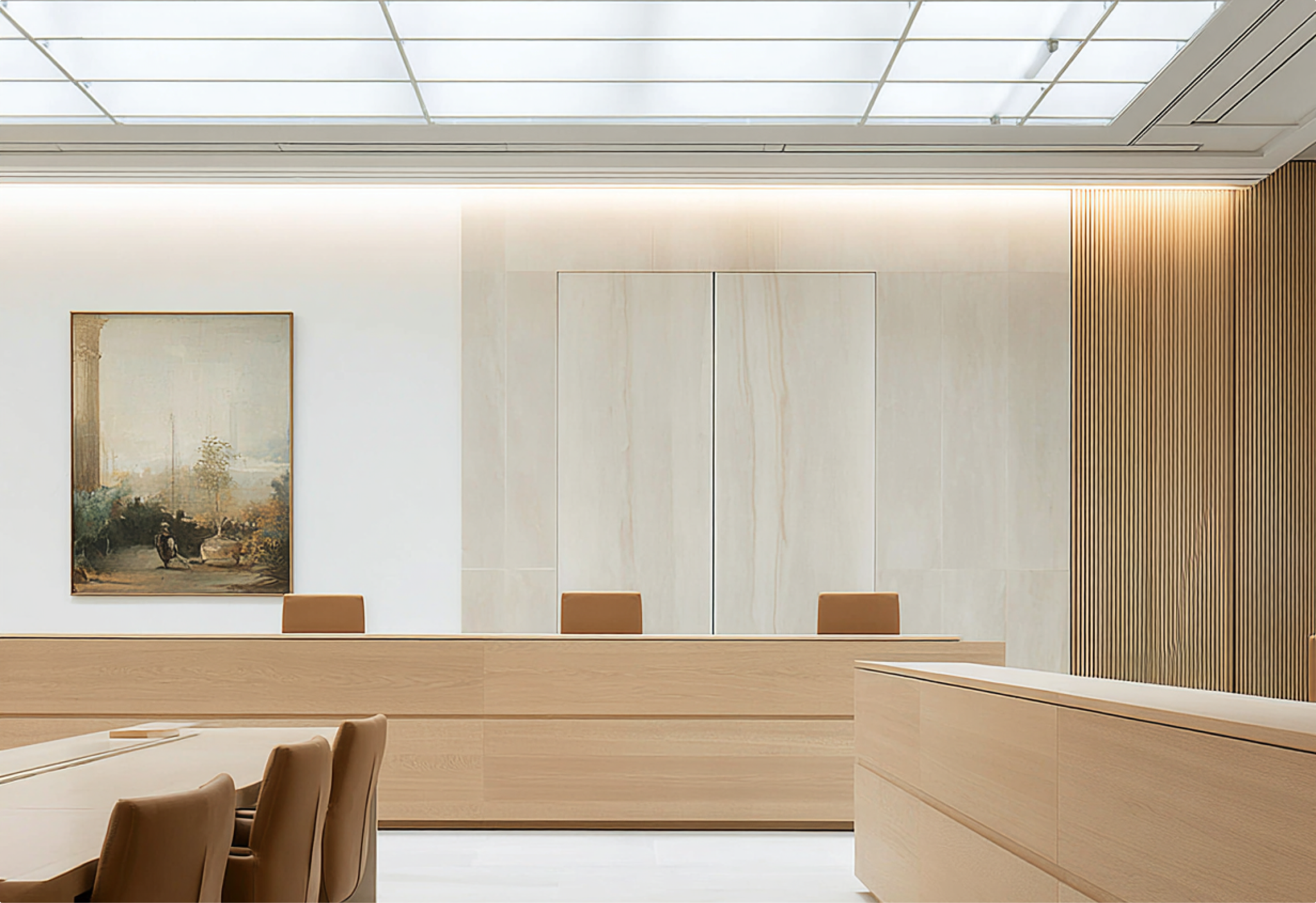 Bright modern courtroom with light wood benches and a painting on the wall