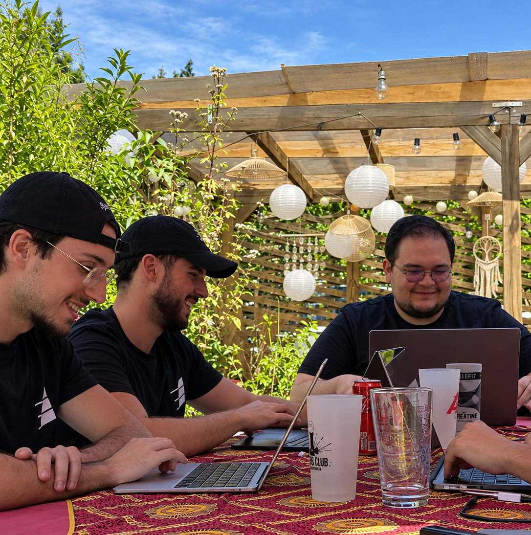 The team working around a table outdoors