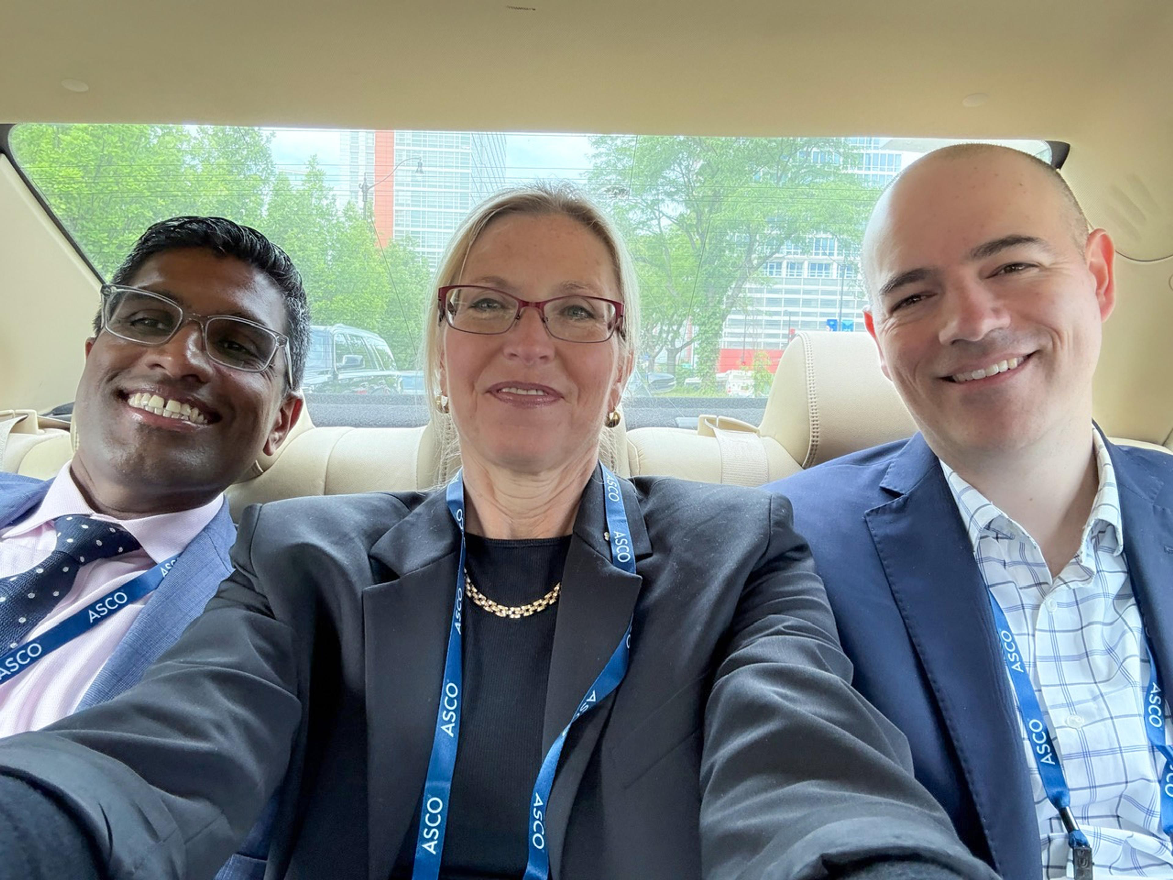 Dr. Mrinal Gounder, Denise Robinson, and Dr. Gregory Cote in an Uber.
