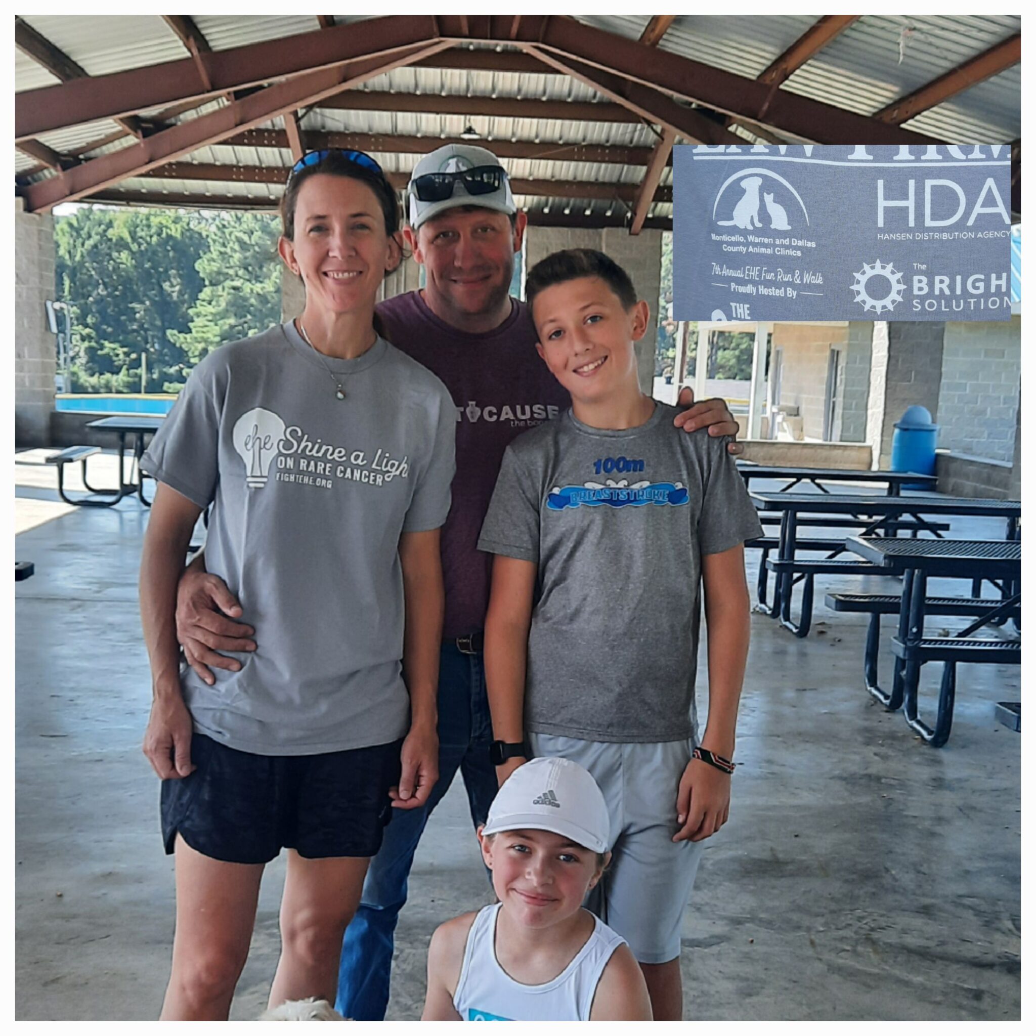 A family of four under a pavilion