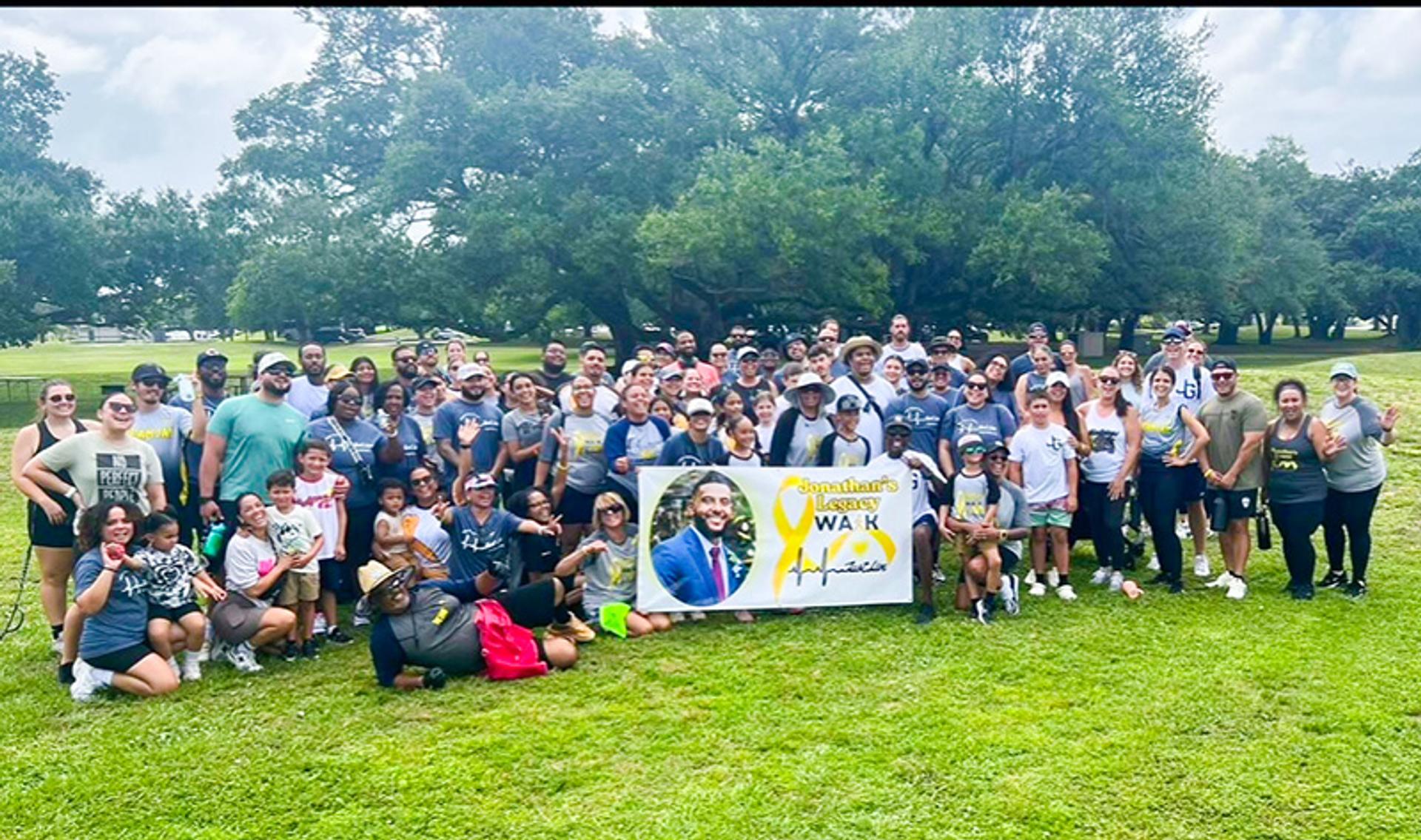 A large walk & run team gathers for a photo