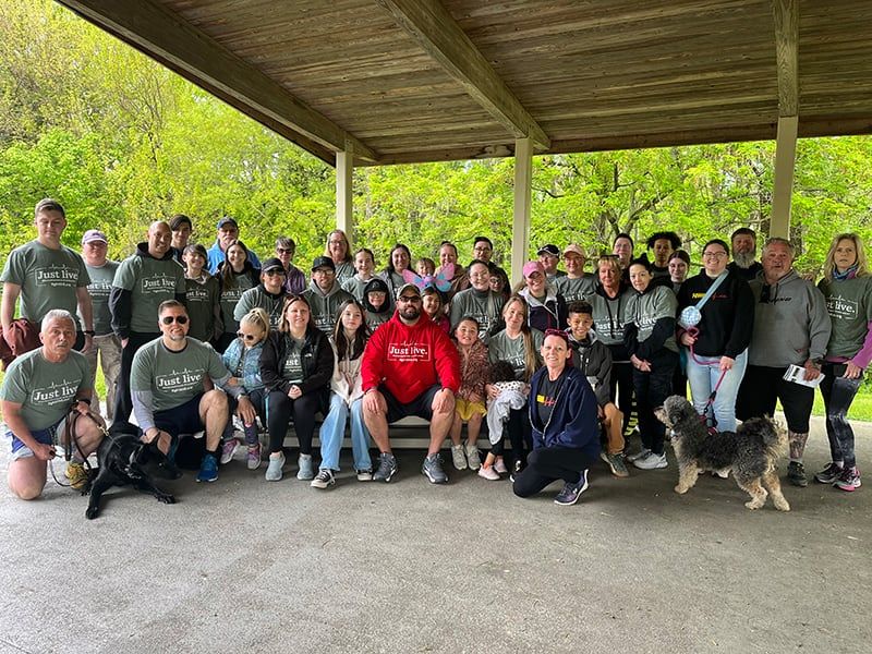 The whole crew under a pavilion