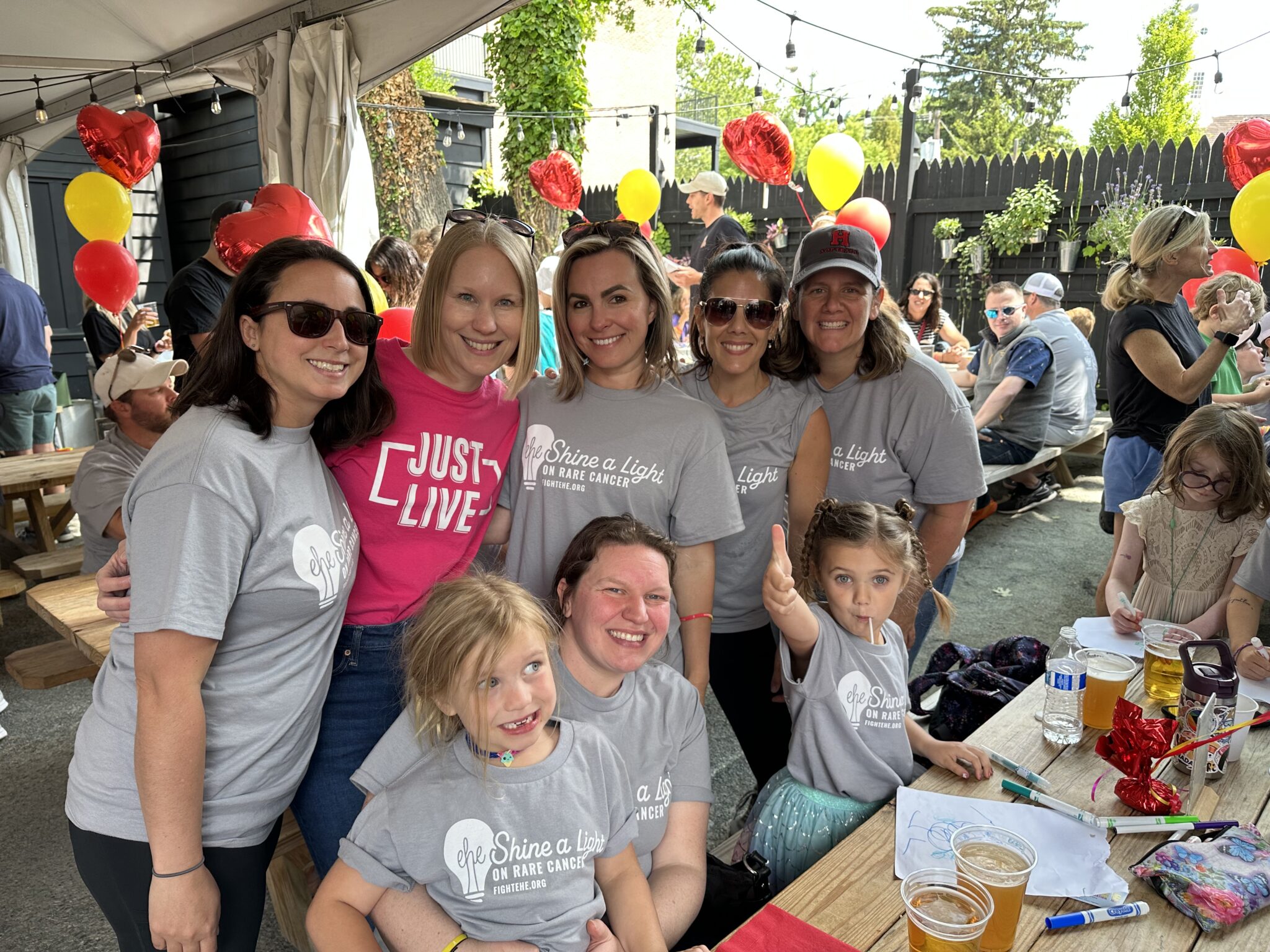 A group of friends come together for a photo at the party