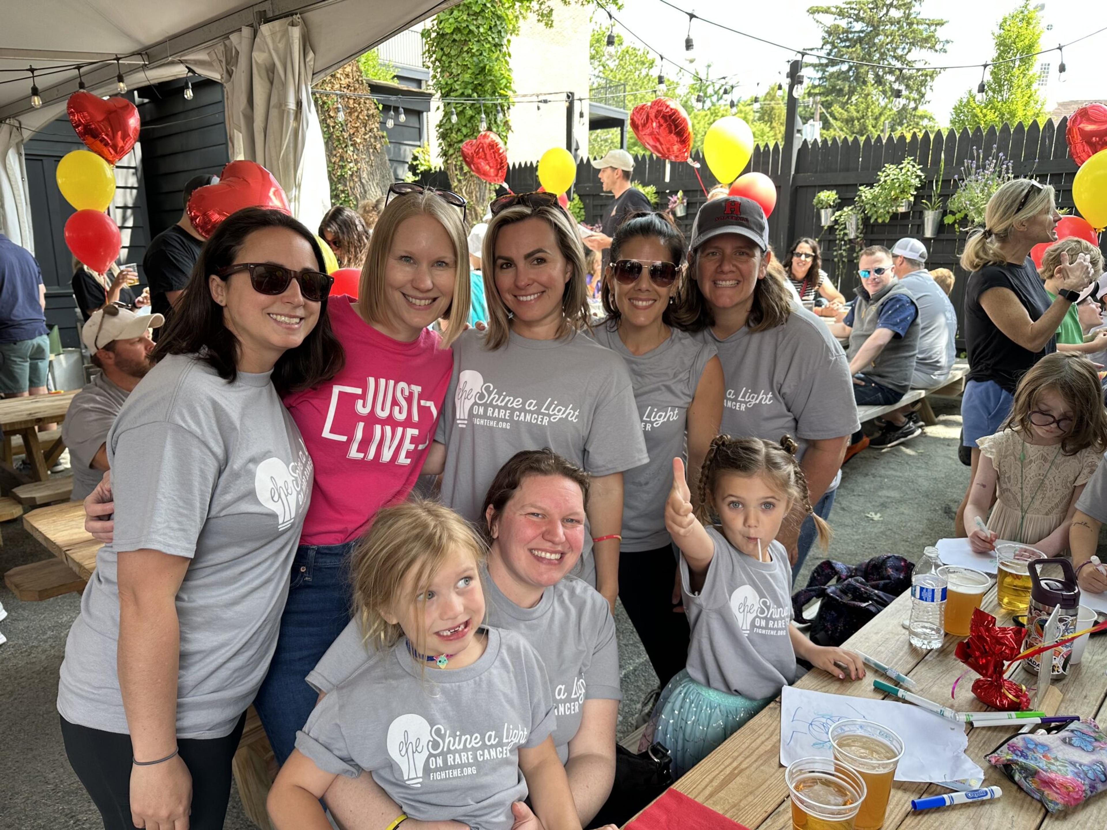 A group of friends come together for a photo at the party