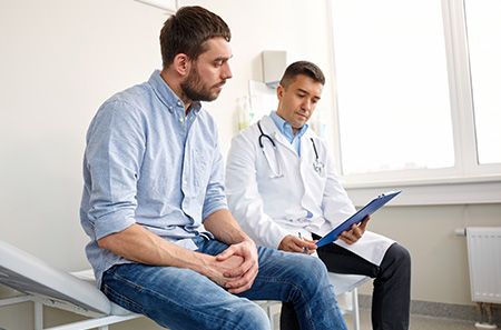 man meeting with his doctor
