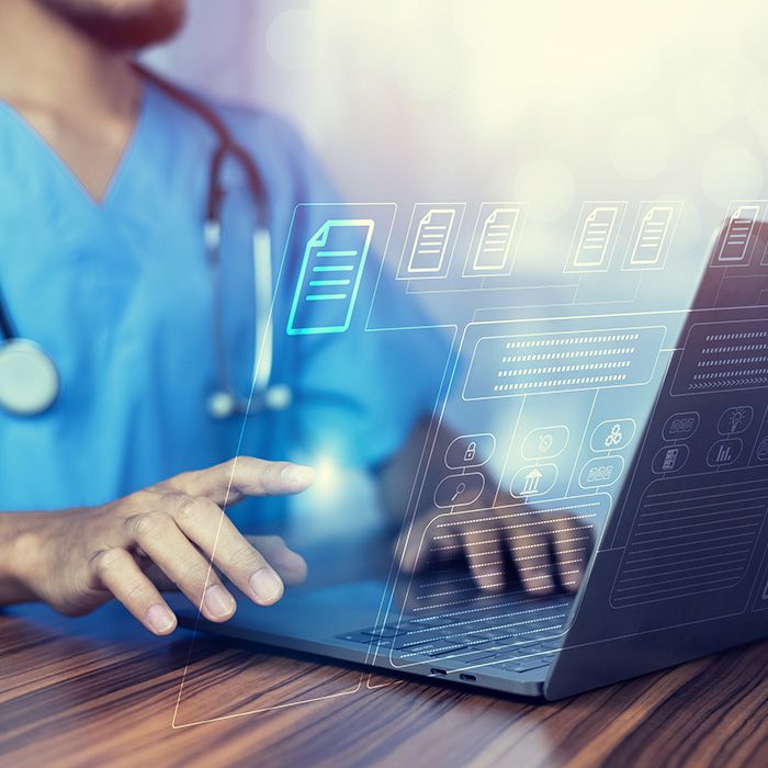 doctor browsing papers on a computer