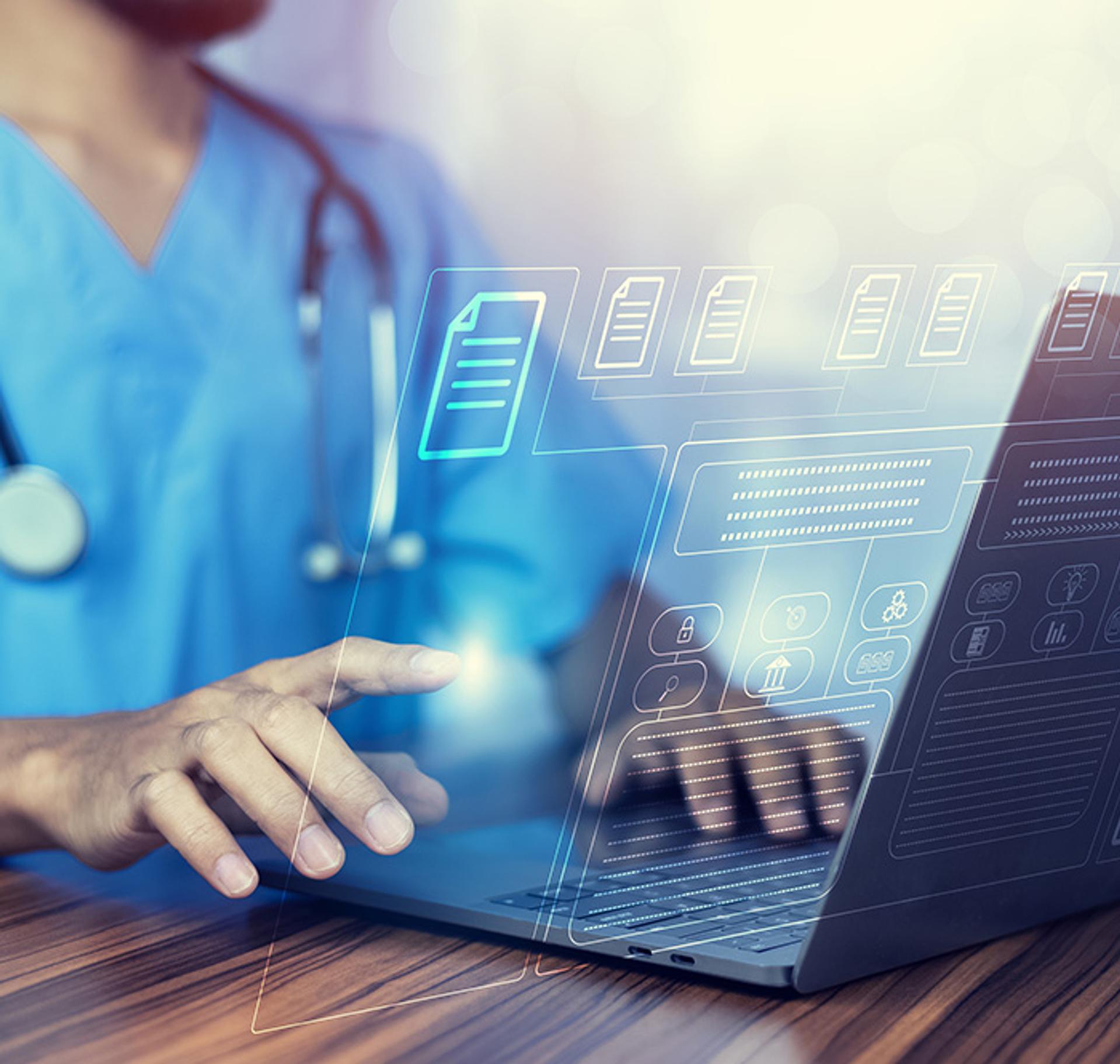 doctor browsing papers on a computer