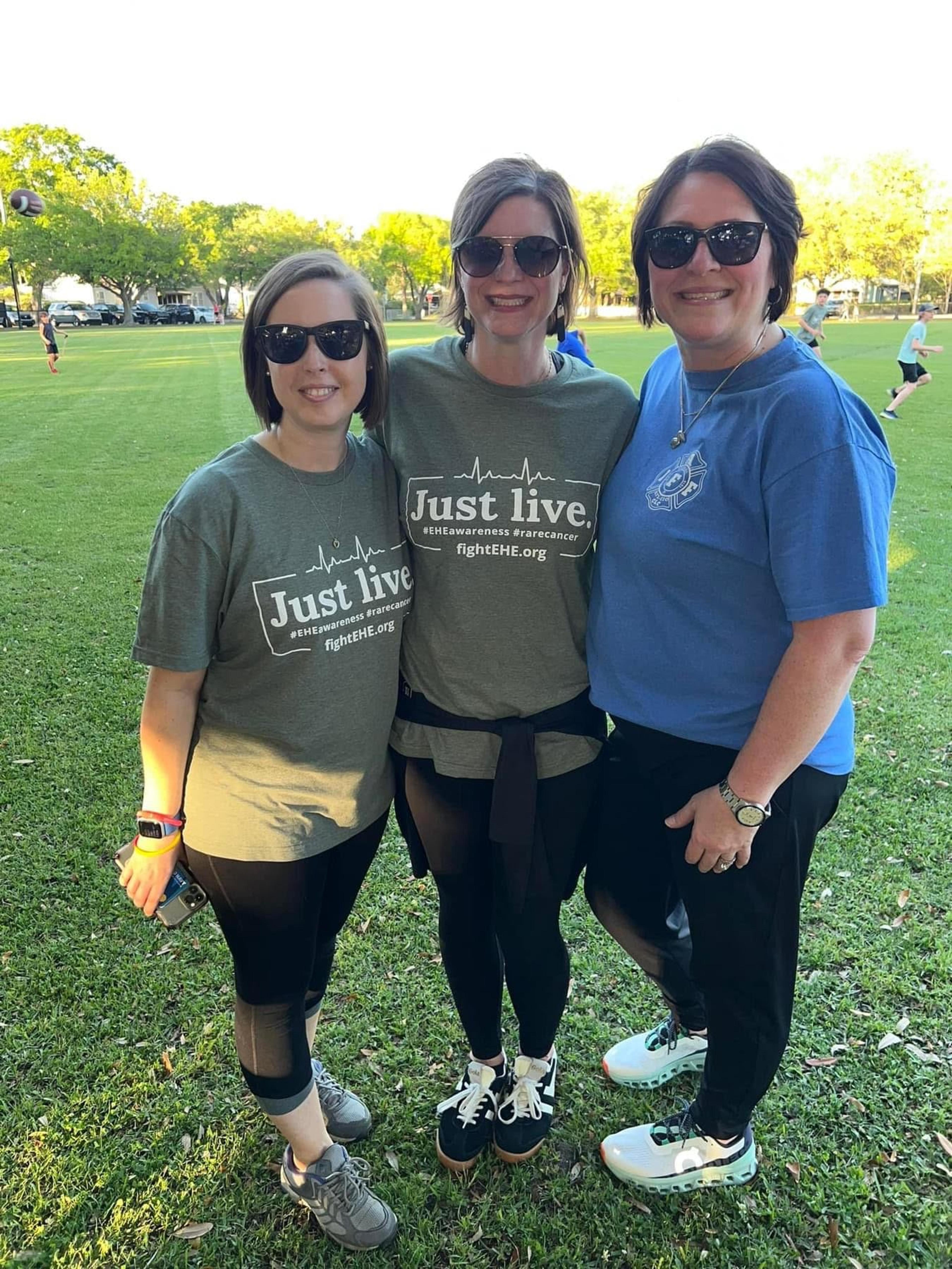 Three woman stand together for a photo