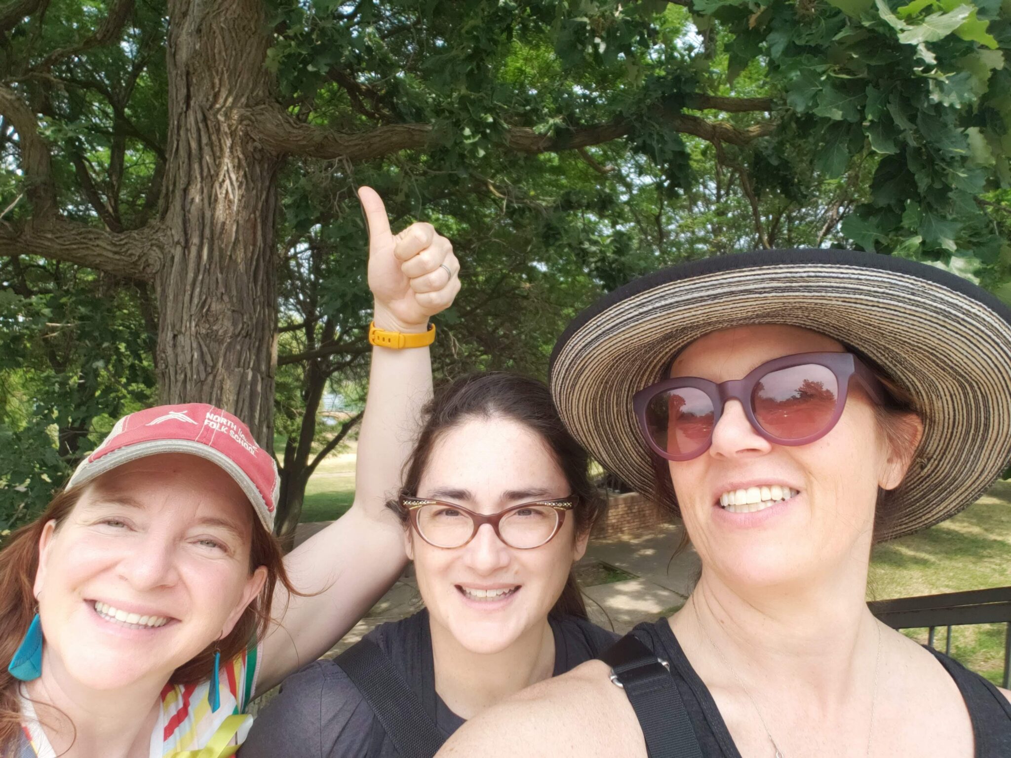 Julie Falkner's selfie with friends with one holding the thumbs up