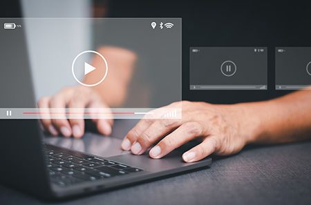 person watching videos on computer