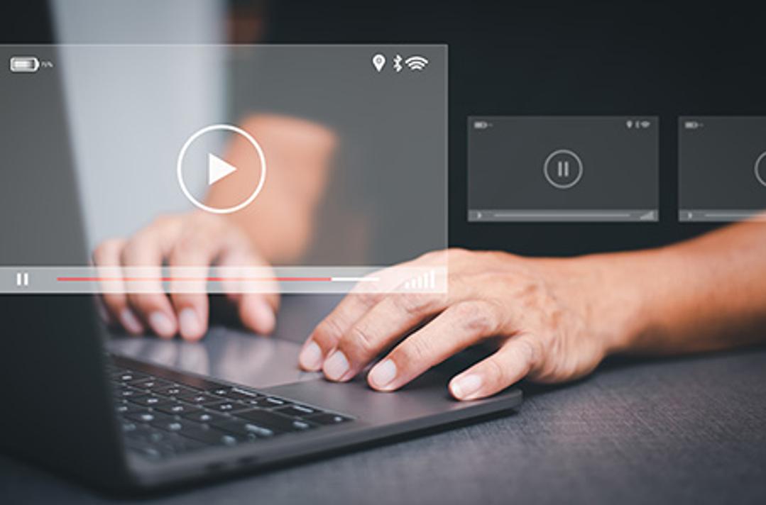 person watching videos on computer