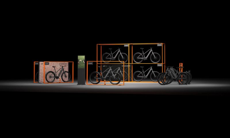 a group of bicycles are stacked on top of each other in a display case .