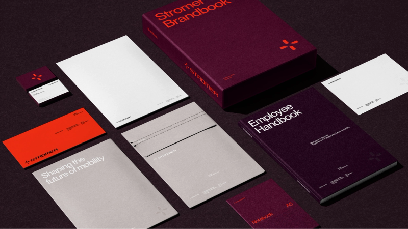 a purple book titled stromer brandbook sits on a table