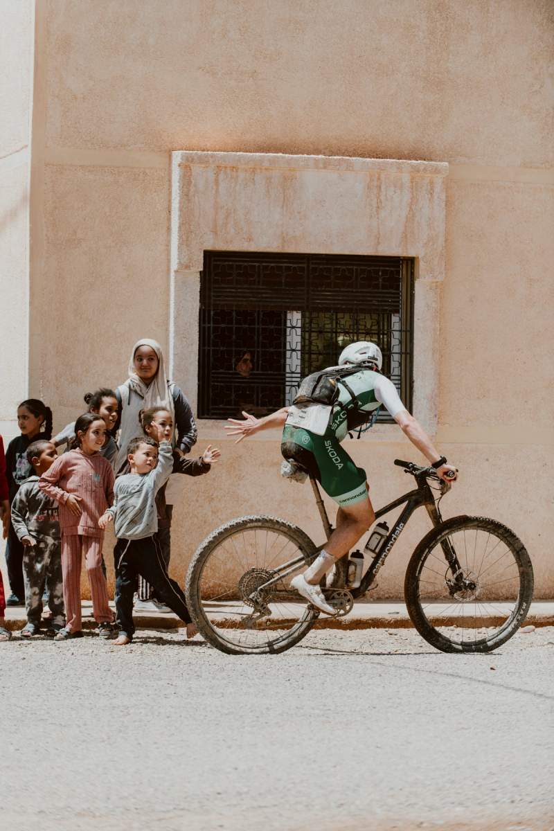 a man riding a bike with the word cannondale on his shorts