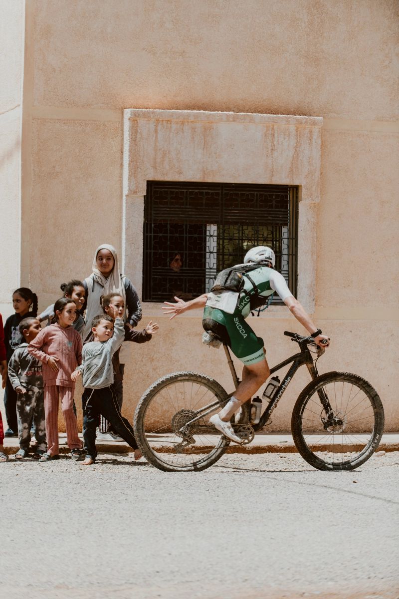 a man riding a bike with the word cannondale on his shorts