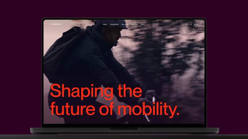 a man is riding a bicycle on a laptop screen .