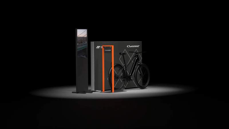 a bicycle is parked in front of a black box .