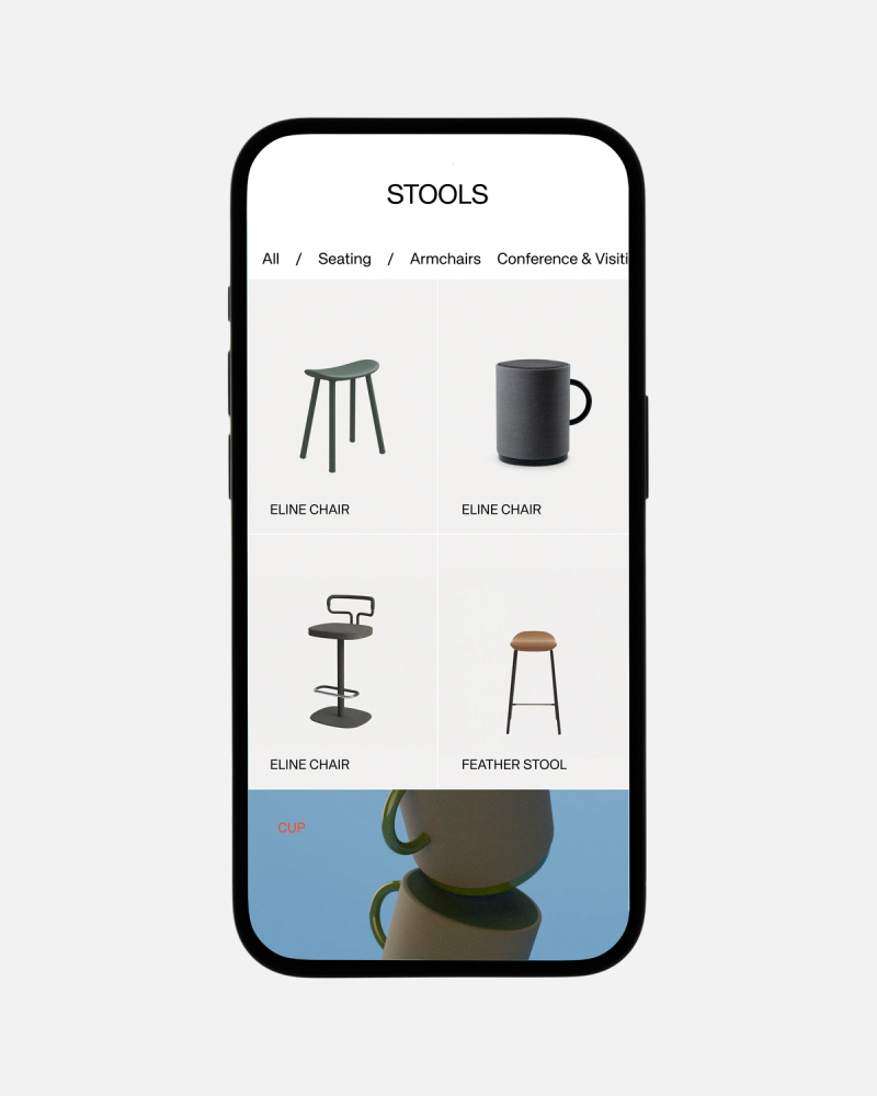 Smartphone displaying an e-commerce page for "STOOLS", showing various stools, a mug, and stacked cups.
