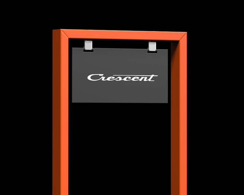 a black sign with the word crescent on it is hanging from an orange frame .