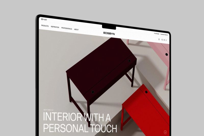A tablet displaying the Edsbyn website featuring red and pink minimalist desks.