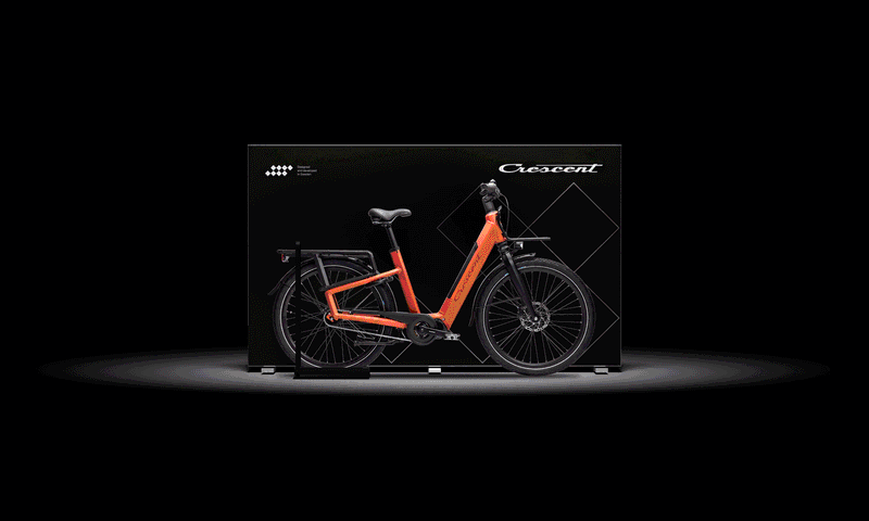an orange bicycle is in a box that says crescent
